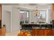 Bright dining area features city views, granite countertops, stainless steel sink, and modern chandelier at 2877 Paradise Rd # 2502, Las Vegas, NV 89109