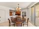 The dining area offers a modern chandelier, seating for six, and easy access to a modern kitchen at 2877 Paradise Rd # 2502, Las Vegas, NV 89109