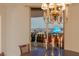 Dining area with a chandelier and floor to ceiling window with scenic city views at 2877 Paradise Rd # 2502, Las Vegas, NV 89109