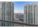 Scenic view from a balcony of two high-rise towers and mountain range in the distance at 2877 Paradise Rd # 2502, Las Vegas, NV 89109