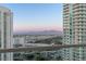 Scenic view from a balcony of two high-rise towers and mountain range in the distance at 2877 Paradise Rd # 2502, Las Vegas, NV 89109