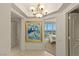 A hallway with tile floors and a painting leads to a bedroom with floor to ceiling views at 2877 Paradise Rd # 2502, Las Vegas, NV 89109