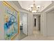 This hallway with tile floor and a chandelier leads to bedrooms at 2877 Paradise Rd # 2502, Las Vegas, NV 89109