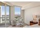 Bright home office space with city views and a modern glass desk situated next to the bedroom's balcony at 2877 Paradise Rd # 2502, Las Vegas, NV 89109