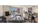 Large living room with city views, fireplace, tile floors, and diverse seating options at 2877 Paradise Rd # 2502, Las Vegas, NV 89109
