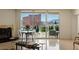 Living room showcases tile floors, transparent chairs, fireplace, and large windows with city views at 2877 Paradise Rd # 2502, Las Vegas, NV 89109