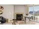 Cozy living room featuring a decorative fireplace and a balcony overlooking the city at 2877 Paradise Rd # 2502, Las Vegas, NV 89109