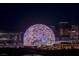 Night view of the Sphere with basketball graphics and surrounding resorts, offering a unique Vegas experience at 2877 Paradise Rd # 2502, Las Vegas, NV 89109