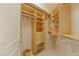 Spacious walk-in closet with custom shelving and drawers for organized storage at 2877 Paradise Rd # 2502, Las Vegas, NV 89109