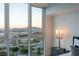 An expansive window captures a breathtaking panoramic view of the city skyline and majestic mountains at 2877 Paradise Rd # 2502, Las Vegas, NV 89109