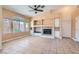 Cozy living room showcases a ceiling fan, fireplace, and built-in cabinetry for storage and display at 2889 Anteres St, Las Vegas, NV 89117