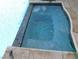 Inviting hot tub with decorative tile trim and refreshing, crystal-clear water at 307 Balsa St, Henderson, NV 89002