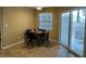 Cozy dining area with sliding glass door to patio at 3150 Soft Breezes Dr # 1008, Las Vegas, NV 89128