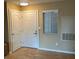 Bright entryway featuring two white doors and a window with mini-blinds at 3150 Soft Breezes Dr # 1008, Las Vegas, NV 89128