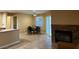 Open living area adjacent to dining room featuring a fireplace at 3150 Soft Breezes Dr # 1008, Las Vegas, NV 89128