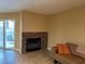 Living room featuring a decorative fireplace and sliding door to patio at 3150 Soft Breezes Dr # 1008, Las Vegas, NV 89128