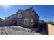 Backyard featuring a rock garden, privacy fence, and desert landscaping at 3339 Cromford Dr, North Las Vegas, NV 89081
