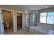 Contemporary bathroom showcasing a glass shower, tub, and a view into the toilet and closet area at 3339 Cromford Dr, North Las Vegas, NV 89081