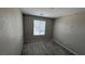 Bright, carpeted bedroom with single window allowing natural light at 3339 Cromford Dr, North Las Vegas, NV 89081