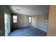This secondary bedroom has carpeted floors, with a sliding glass door and multiple windows at 3339 Cromford Dr, North Las Vegas, NV 89081