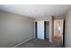 Carpeted bedroom with closet and hallway view offering a neutral palette ready for personalization at 3339 Cromford Dr, North Las Vegas, NV 89081