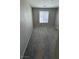 Bright, carpeted bedroom with single window allowing natural light at 3339 Cromford Dr, North Las Vegas, NV 89081