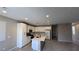 Modern kitchen with stainless appliances, white cabinetry, and island countertop at 3339 Cromford Dr, North Las Vegas, NV 89081