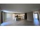 Bright, open kitchen with white cabinets, an island, and wood-look tile flooring at 3339 Cromford Dr, North Las Vegas, NV 89081