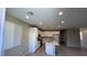 Bright kitchen features white cabinets, modern appliances, and an island at 3339 Cromford Dr, North Las Vegas, NV 89081