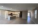 Bright kitchen with island and stainless appliances, seamlessly connecting to the living area at 3339 Cromford Dr, North Las Vegas, NV 89081