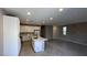 Open-concept kitchen features an island, modern appliances, and sleek countertops at 3339 Cromford Dr, North Las Vegas, NV 89081