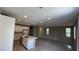 Open-concept kitchen features an island, modern appliances, and sleek countertops at 3339 Cromford Dr, North Las Vegas, NV 89081