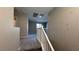 Neutral walls meet carpeted floors on the upstairs landing with white banister at 3339 Cromford Dr, North Las Vegas, NV 89081