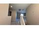 Neutral walls meet carpeted floors on the upstairs landing with white banister at 3339 Cromford Dr, North Las Vegas, NV 89081