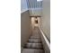 Carpeted stairs lead to the lower level, with a view of the downstairs bathroom at 3339 Cromford Dr, North Las Vegas, NV 89081
