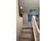 Carpeted stairway with white railing leading to the upper level of the home at 3339 Cromford Dr, North Las Vegas, NV 89081