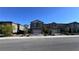 Street view of single Gathering homes with attached garages at 3339 Cromford Dr, North Las Vegas, NV 89081