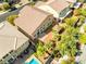 Aerial view showing a landscaped backyard with patio, gazebo, manicured lawn and nearby homes at 4212 Hawks Glide Ave, North Las Vegas, NV 89084