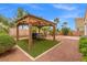 Backyard featuring an outdoor BBQ grill and a covered patio with a picnic table at 4212 Hawks Glide Ave, North Las Vegas, NV 89084