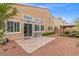 Backyard featuring a stone-paved patio and a covered patio with seating at 4212 Hawks Glide Ave, North Las Vegas, NV 89084