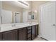 This bathroom features a double vanity with dark cabinets and plenty of storage space at 4212 Hawks Glide Ave, North Las Vegas, NV 89084