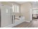 This bathroom features a glass shower enclosure and a separate tub for relaxation at 4212 Hawks Glide Ave, North Las Vegas, NV 89084