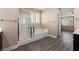 A bathroom boasts a glass enclosed shower, soaking tub, and wood-style flooring at 4212 Hawks Glide Ave, North Las Vegas, NV 89084