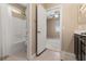 Bathroom showing a shower/tub combo and an open door looking into an empty bedroom at 4212 Hawks Glide Ave, North Las Vegas, NV 89084