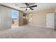 An airy room featuring a ceiling fan and access to a balcony with great views at 4212 Hawks Glide Ave, North Las Vegas, NV 89084