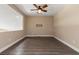 Spacious and open bonus room with ceiling fan and modern flooring at 4212 Hawks Glide Ave, North Las Vegas, NV 89084