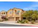 Charming two-story home featuring stucco siding, a balcony, three-car garage, and neatly landscaped yard at 4212 Hawks Glide Ave, North Las Vegas, NV 89084