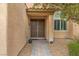 Close-up of the double front door framed by decorative trim and a security system at 4212 Hawks Glide Ave, North Las Vegas, NV 89084