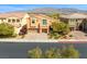 Aerial shot of home featuring manicured front yard with trees and a 3-car garage at 4212 Hawks Glide Ave, North Las Vegas, NV 89084