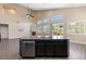 Modern kitchen with a large island, stainless steel appliances and a view of the living room at 4212 Hawks Glide Ave, North Las Vegas, NV 89084